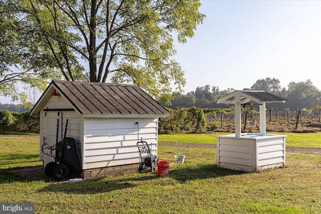 view of outbuilding with a yard