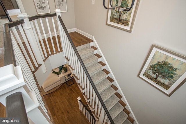 stairway with dark wood-type flooring