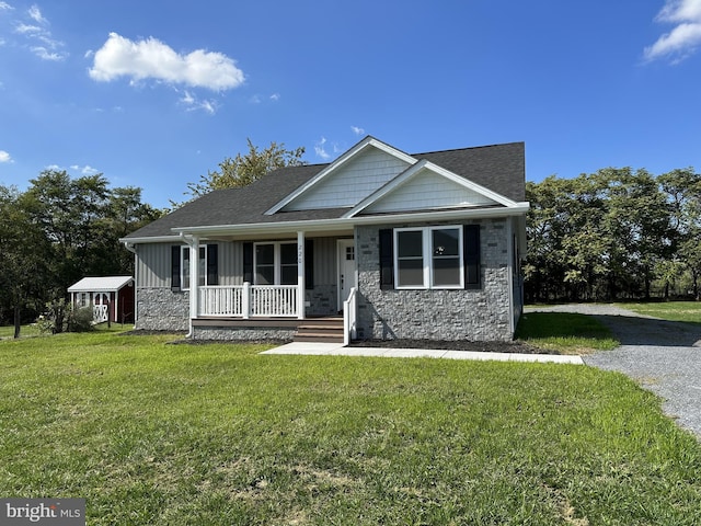 view of front of house with a front lawn and covered porch