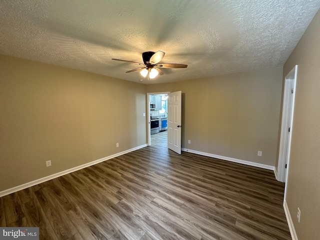 unfurnished room featuring ceiling fan, dark hardwood / wood-style floors, and a textured ceiling