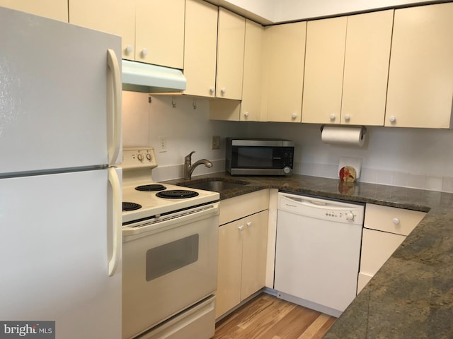 kitchen featuring white appliances, light hardwood / wood-style flooring, sink, and white cabinetry