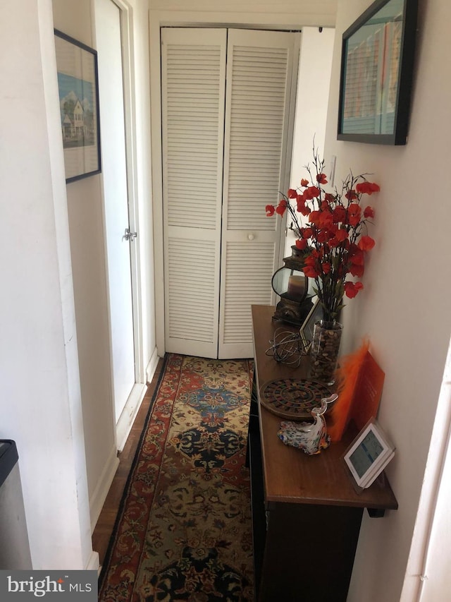 hall with dark hardwood / wood-style floors