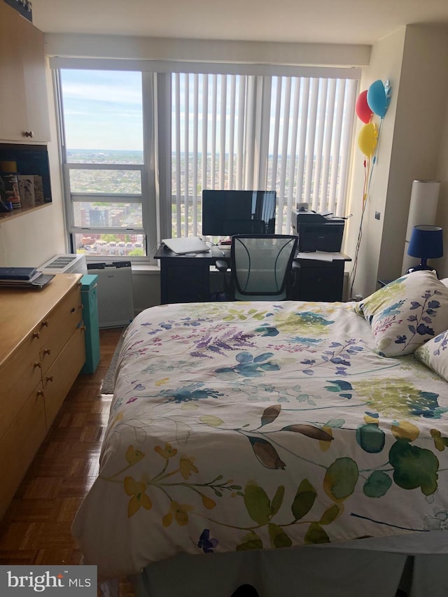 bedroom with dark parquet floors