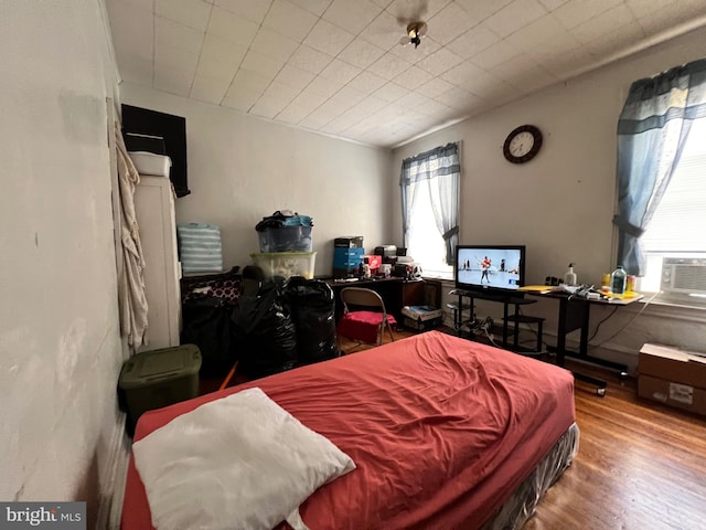 bedroom featuring hardwood / wood-style flooring