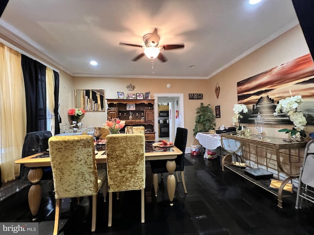 dining room featuring ceiling fan and ornamental molding