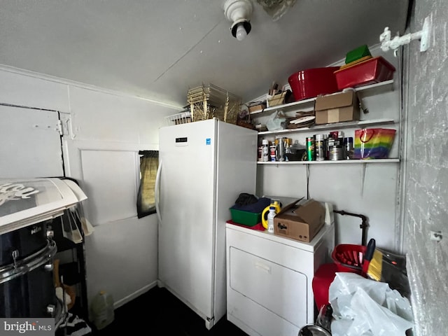 clothes washing area featuring washer / dryer