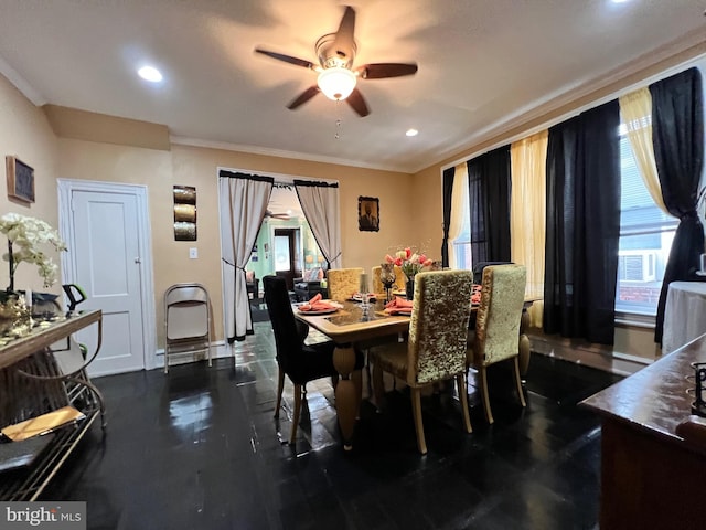 dining area with ceiling fan and crown molding