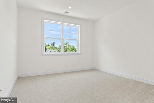 unfurnished room featuring carpet flooring