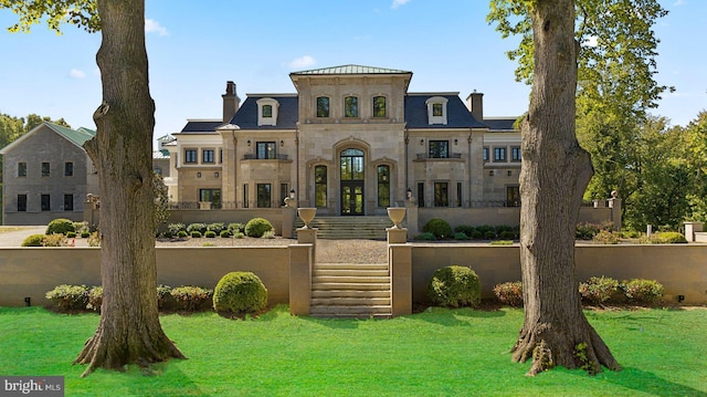 view of front of property with french doors and a front yard