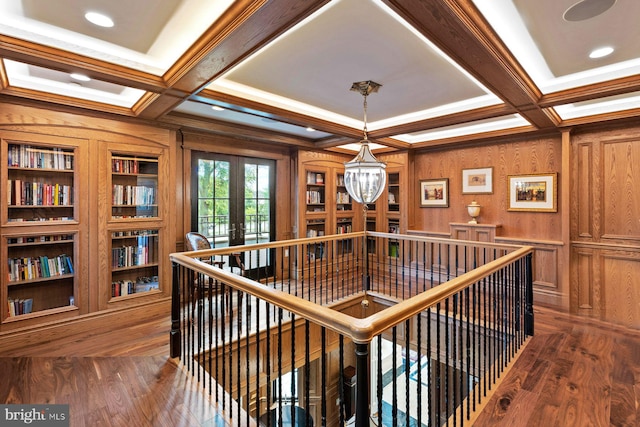 corridor with french doors, dark hardwood / wood-style flooring, coffered ceiling, and beam ceiling