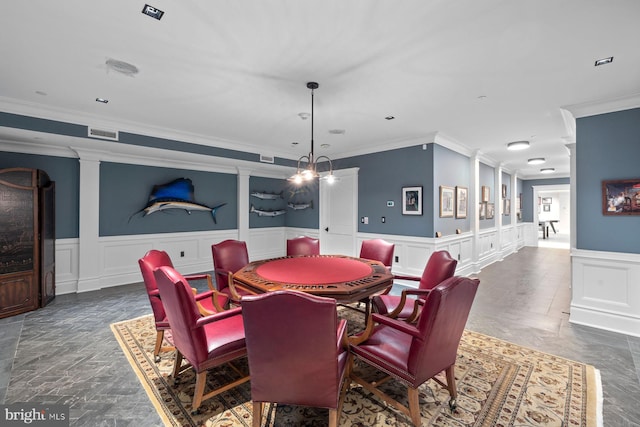 2801 Riverton Rd, Moorestown, NJ 08057 - dining space featuring crown molding, wainscoting, a decorative wall, and decorative columns