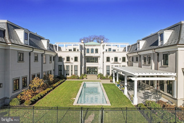 exterior space with a yard, a pergola, and a patio