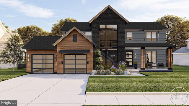 view of front of home featuring a garage and a front lawn