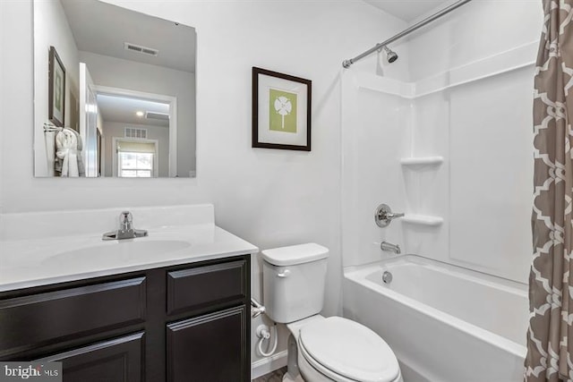 full bathroom featuring shower / bath combination with curtain, vanity, and toilet