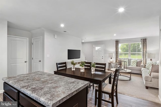 interior space with light wood-type flooring and a kitchen island