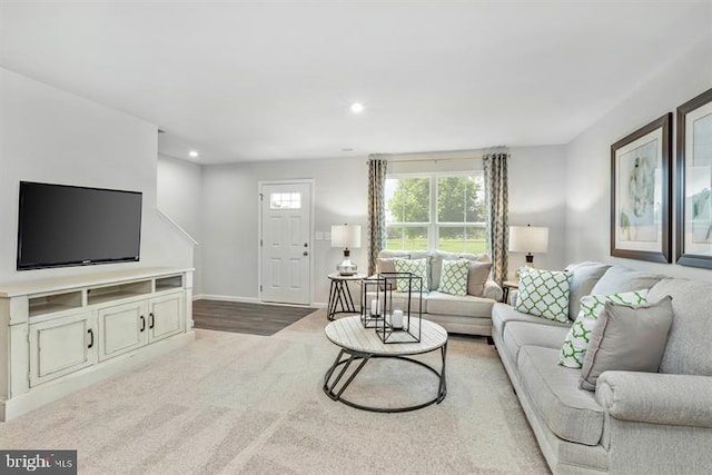 living room with light hardwood / wood-style flooring