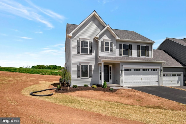 view of front of property featuring a garage