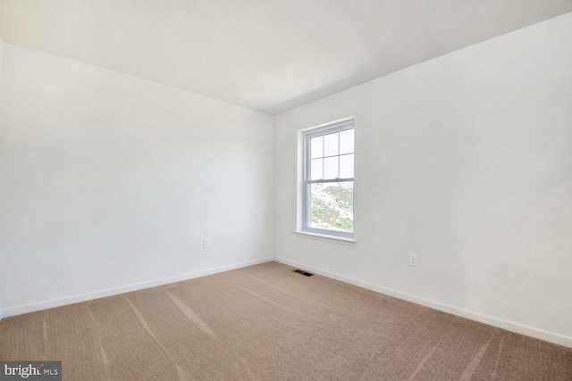 view of carpeted spare room