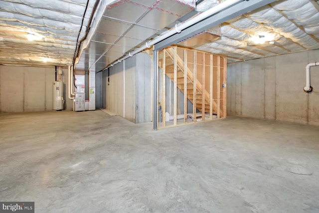 basement featuring water heater and heating utilities