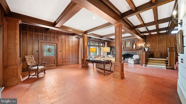 1717 Woodland Rd, Abington, PA 19001 - sitting room featuring coffered ceiling, wood walls, light tile flooring, beamed ceiling, and decorative columns