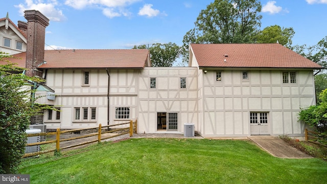 1717 Woodland Rd, Abington, PA 19001 - rear view of property with central AC and a yard