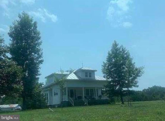 exterior space with a yard and a porch