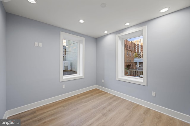 unfurnished room featuring light hardwood / wood-style flooring