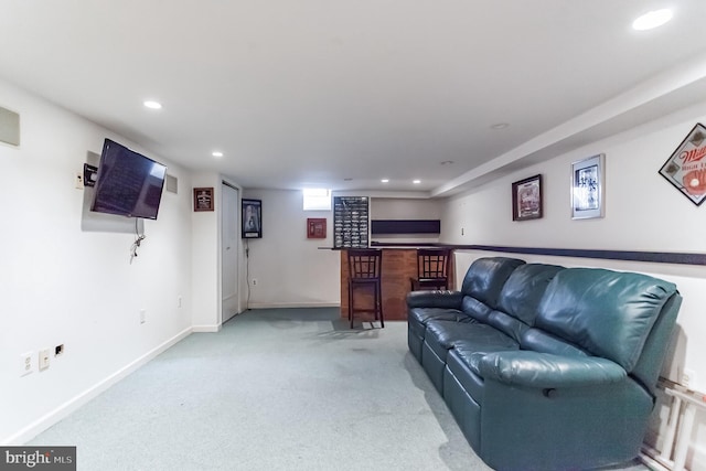 living room featuring light carpet and bar area