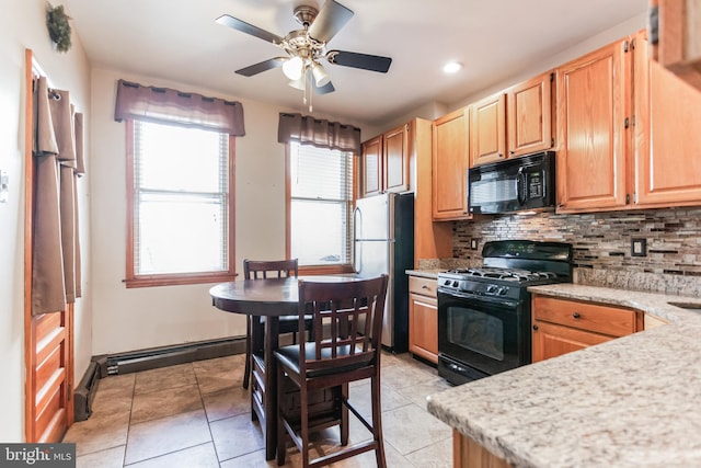 kitchen featuring light tile floors, ceiling fan, backsplash, and black appliances