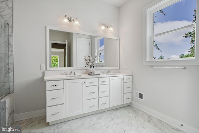 bathroom with double vanity and tile flooring