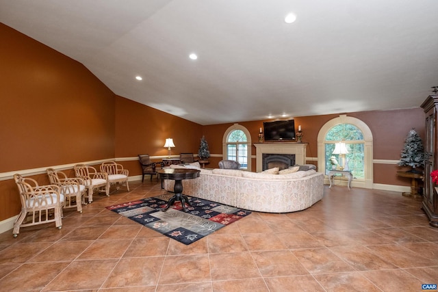 tiled living room with vaulted ceiling