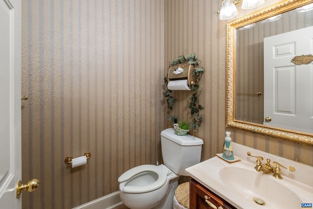 bathroom with toilet and vanity