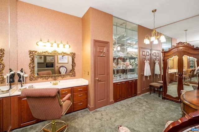 bathroom featuring vanity and a chandelier