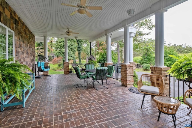 sunroom / solarium featuring ceiling fan