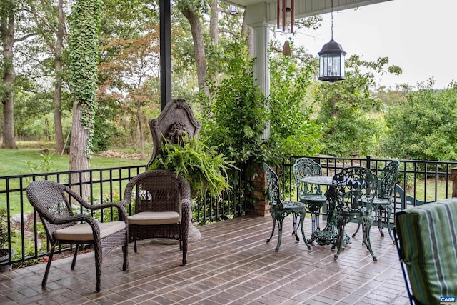 wooden terrace featuring a patio area