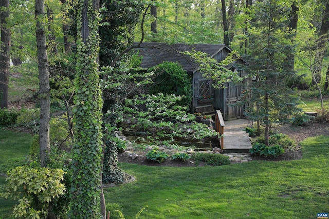 obstructed view of property featuring a front yard