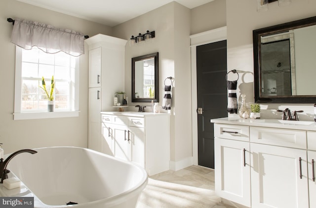 bathroom featuring tile patterned floors, a washtub, and double sink vanity