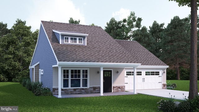 view of front of house with a front yard and a garage