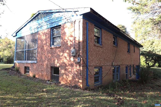 view of property exterior featuring a sunroom