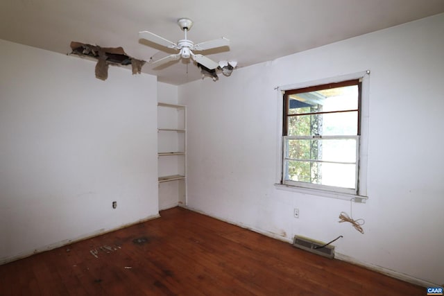 unfurnished room featuring ceiling fan and dark hardwood / wood-style flooring