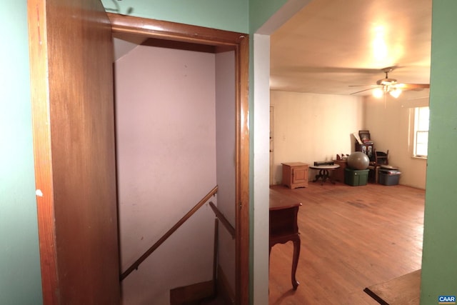 hallway with light hardwood / wood-style flooring