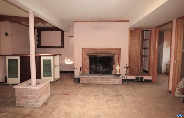 living room featuring a brick fireplace