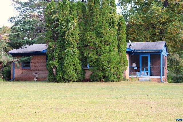 view of yard featuring a sunroom