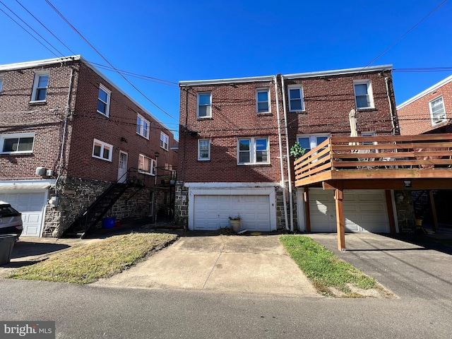 back of property featuring a deck