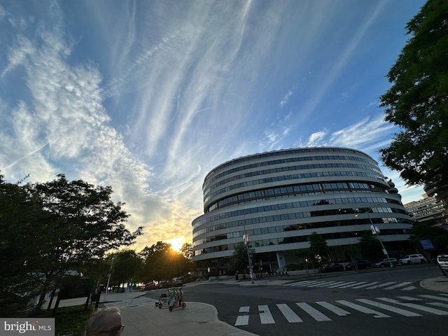 view of outdoor building at dusk