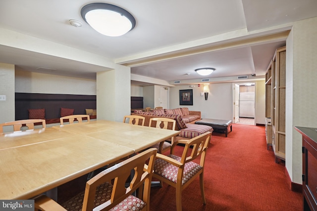 view of carpeted dining space