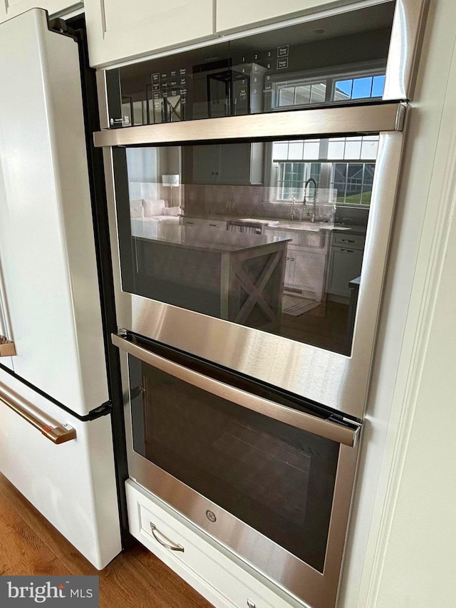 994 Valley Crossing Dr, Lititz, PA 17543 - details with dark wood finished floors and freestanding refrigerator