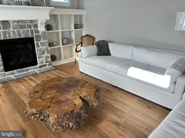 994 Valley Crossing Dr, Lititz, PA 17543 - living room featuring a stone fireplace and wood finished floors