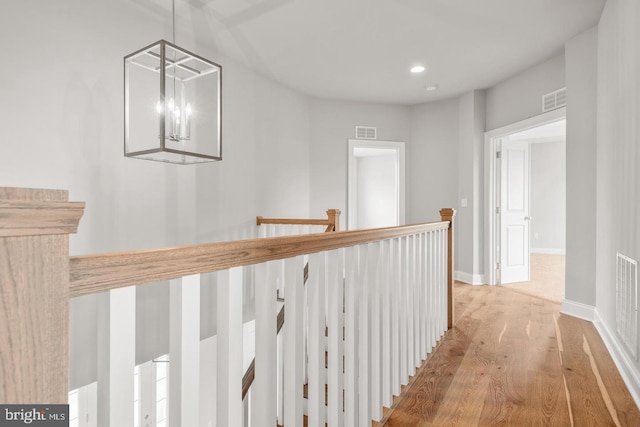 994 Valley Crossing Dr, Lititz, PA 17543 - hallway featuring baseboards, an upstairs landing, light wood-style flooring, and visible vents
