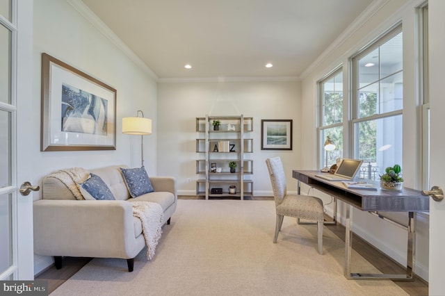 office with crown molding and light hardwood / wood-style floors